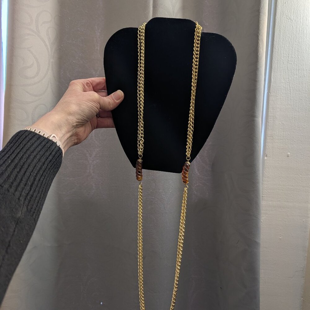 Double strand gold tone necklace with root beer colored fuax lucite stones